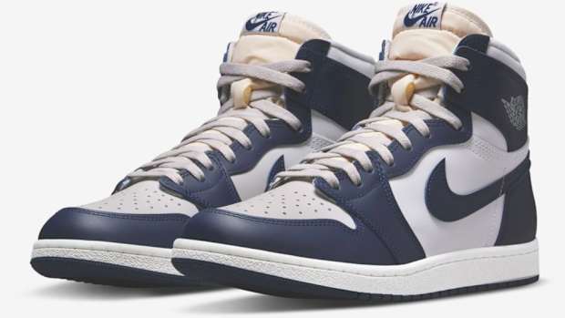 View of navy and grey Air Jordan shoes.